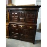 An Antique Oak Welsh Panelled Deuddarn Of Typical Form Having A Bank Of Three Drawers To The Centre