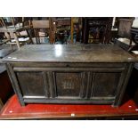 An Antique Oak Coffer Having A Three Panel Front With Carved Initials