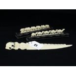 A Carved Bone Paper Knife In The Form Of A Train Of Elephants Together With Two Further Trains