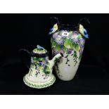 A Circular Based Two Handled Contemporary Floral Decorated Vase By Jeanette McCall Together With A