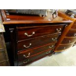 A Reproduction Mahogany Finish Chest Of Four Long Drawers