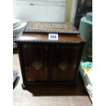 A Regency Rosewood And Brass Inlaid Table Cabinet