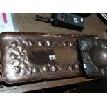 A Newlyn Rectangular Embossed Copper Tray Together With A Further Copper Tray