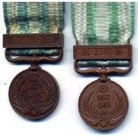 Japan, 1900 War Medal (Boxer Rebellion), in bronze (2), the first with contemporary ribbon and