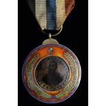 *China, Republic, Wu Pei Fu Military Marksmanship Medal, circa 1925, in silver-gilt and enamels,