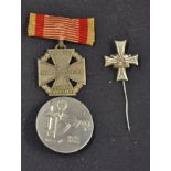 Third Reich Medals to include a lapel pin for the Stalingrad vets, silver plate on tomback bronze