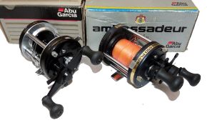 REELS: (2) Abu Ambassadeur 6001C LHW multiplier reel, in as new condition, smooth black end