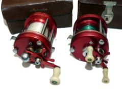 REELS: (2) Abu Ambassadeur  5000 red multiplier reel, grooved end plates, twin white handles,