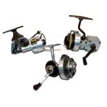 REELS: (3) Three unusual scratch or engineered built fixed spool spinning reels, fully encased model