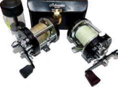 REELS: (2) Abu Ambassadeur 6000C black multiplier reel,3 screw smooth end plates, foot stamp 730802,