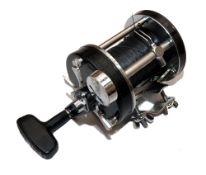 REEL: Abu Ambassadeur 7000 C multiplier reel, smooth black end plates, 3 screw model, foot stamp