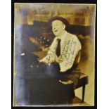 Autograph Jimmy Durante 1893-1980 Signed Print sat at the piano, inscribed 'A pleasure believe me,