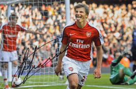 Arsenal Andrey Arshavin signed photograph in Arsenal colours celebrating, overall 45.5 x 35.5cm,