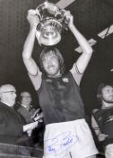 West Ham United Billy Bonds signed black and white print signed in ink, holding the FA Cup,