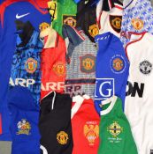 Large Collection of Manchester United football shirts all replica, seasons include 1990s through