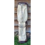 Good leather and canvas oval golf bag complete with ball pocket, original shoulder strap (some