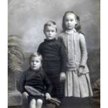 Tennis Studio photograph c.1910 - hand tinted portrait of 3x children with one holding an early play