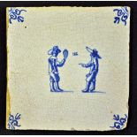 Battledore: rare Delft blue and white tile c.1660 - with fleur de lys decorative corners and 2 men