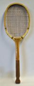 A Superb wooden fishtail tennis racket - fitted with a concave wedge, red and plain double centre