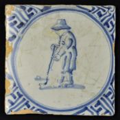 Vintage Blue and white Kolfing Scene tile some cracks and deterioration present, figure clear to the