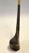 Rare and early McEwan dark stained hooked deep face beech wood small and narrow longnose spoon c.