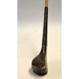 Rare and early McEwan dark stained hooked deep face beech wood small and narrow longnose spoon c.