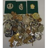 Large Selection of Military Cap Badges to include British and German examples, with some shoulder