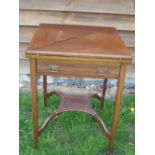 Edwardian Mahogany Card Table with an envelope top over a channel moulded frieze drawer, raised on