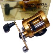 REEL: Penn International 975 gold finish multiplier reel, free spool, star drag, level wind, rod