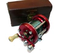 REEL: Early Abu Ambassadeur 6000, red grooved end plates, 4 screw, white handle, no foot stamp,
