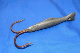 JIG LURE: Early lead fish shaped jig lure, 6" body, with 2 large barbed hooks to front, used for ice