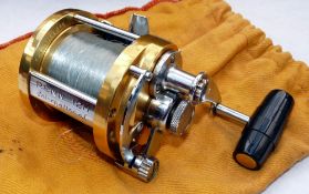 REEL: Penn International 12H multiplier reel, gold finish, lever drag with pre-set, rod saddle