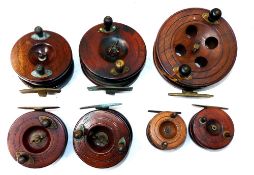 REELS: (7) Collection of 7 assorted Nottingham pattern wooden reels, a 5" Eaton Sun starback with