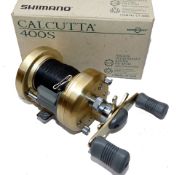 REEL: Shimano Calcutta 400S multiplier reel, gold finish, tournament style frame, star drag and free