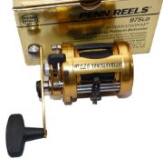 REEL: Penn International 975LD gold finish multiplier reel, free spool, star drag, level wind, rod