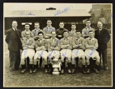 Signed Manchester United black and white team photograph taken at Old Trafford and featuring the