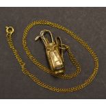 9ct golf bag and golf club charm c/w a yellow metal chain - wt 8.1gms