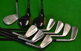 A complete set of Spalding Gold Medal clubs to include 2x persimmon woods, a driver and a 3 wood,