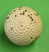 'The Colonel' Red Dot bramble pattern rubber core golf ball with the patent number to the opposite