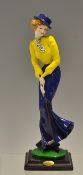 Fine hand painted figure of an early 1900's lady golfer - putting in long flowing skirt by