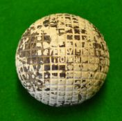 The Silver Town large moulded mesh lined gutty golf ball - retaining most of the original white