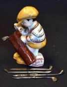 Mabel Lucie Attwell continental china golfing caddie figure holding a golf bag containing a manicure