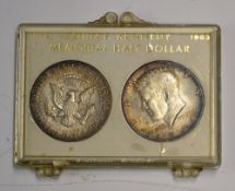 Pair of John F Kennedy Memorial Half Dollar Coins 1964 appears P and D coins within plastic casing