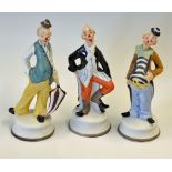 3x Porcelain Hobo Style Bisque Clown Figurines featuring three colourful standing figures, no makers