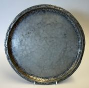 Hugh Wallis 1871-1943 Pewter Charger with a folded rim with punched decoration, stamped to the