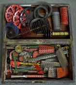 Selection of Meccano including wheels, cogs, gears, red and green, worth inspecting, used but