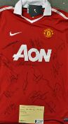 2010 Manchester United Signed football shirt extensively signed by players including Rooney, Evra,