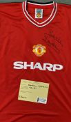 Bryan Robson Signed Manchester United football shirt with No 7 to the back, signed to both front and