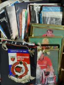 Collection of Manchester United memorabilia with programme binders (empty), mixed videos, player