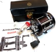 REEL: Abu Ambassadeur 6000C black multiplier reel, foot stamp 097100, 3 screw grooved end plate,